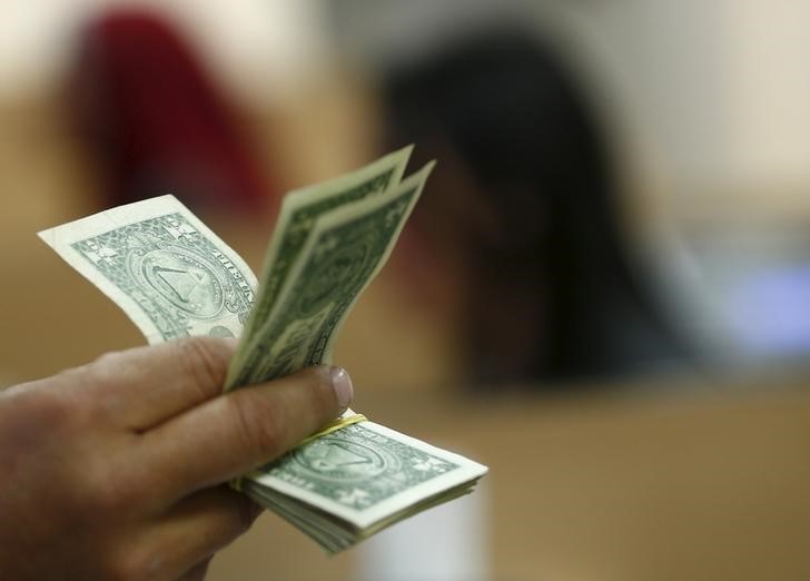 Dollar bides time beneath two-month highs before pay sheets test
