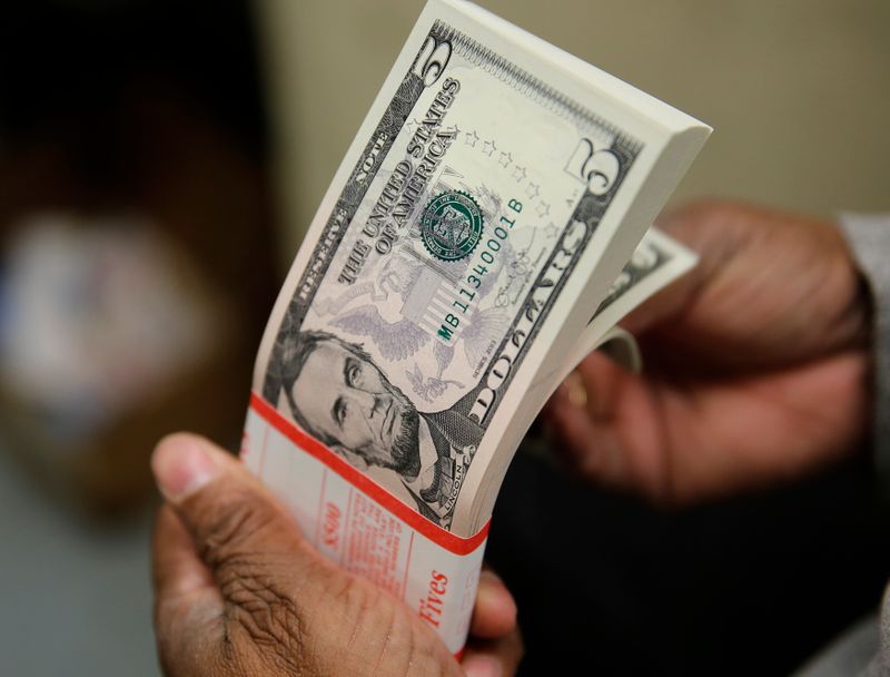 Dollar ekes out 2nd week of gains on Fed view